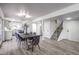 Open-concept dining area featuring a contemporary design and a seamless connection to the kitchen and staircase at 2834 Natalie Ave, Las Vegas, NV 89121