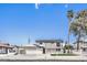 Charming two-story home with a covered parking area, balcony, a small lawn, and desert landscaping at 2834 Natalie Ave, Las Vegas, NV 89121