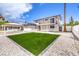 Two-story home with a covered carport and a small lawn with desert landscaping at 2834 Natalie Ave, Las Vegas, NV 89121