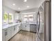 Modern kitchen with stainless steel appliances, white countertops and cabinets at 2834 Natalie Ave, Las Vegas, NV 89121