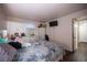 Bedroom with laminate floors, a white dresser and a closet at 2969 Juniper Hills Blvd # 103, Las Vegas, NV 89142
