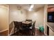 Cozy dining area features wood-look floors, ceiling fan and decorative wall art at 2969 Juniper Hills Blvd # 103, Las Vegas, NV 89142