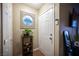 Inviting entryway featuring stylish decor, tile flooring, and convenient coat closet at 2969 Juniper Hills Blvd # 103, Las Vegas, NV 89142