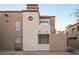 Unique condo with light stucco walls and contrasting trim with decorative facade features at 2969 Juniper Hills Blvd # 103, Las Vegas, NV 89142