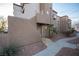 Charming condo featuring a stucco exterior with well-maintained landscaping and walkways at 2969 Juniper Hills Blvd # 103, Las Vegas, NV 89142