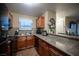 Functional kitchen features granite countertops, wood cabinets, and stainless steel appliances at 2969 Juniper Hills Blvd # 103, Las Vegas, NV 89142