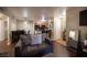 Open-concept living area featuring hardwood floors, comfortable seating, and a view of the kitchen at 2969 Juniper Hills Blvd # 103, Las Vegas, NV 89142