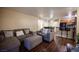Inviting living area with hardwood floors, opening to dining and kitchen with breakfast bar at 2969 Juniper Hills Blvd # 103, Las Vegas, NV 89142