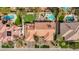 Aerial view of a stunning residence with a red tile roof, a lush yard and a private pool and spa at 3236 Cliff Sieler Ct, Las Vegas, NV 89117