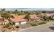 Aerial view of home showing tile roof, desert landscaping, and paved driveway at 3236 Cliff Sieler Ct, Las Vegas, NV 89117