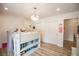 Bright bedroom featuring a loft bed with bookcase and a view of the outdoors at 3236 Cliff Sieler Ct, Las Vegas, NV 89117