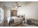 Comfortable bedroom with modern furnishings and wood-look floors at 3236 Cliff Sieler Ct, Las Vegas, NV 89117