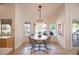 Charming dining area with a stylish chandelier and views of the backyard and pool at 3236 Cliff Sieler Ct, Las Vegas, NV 89117