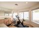 Exercise room with mounted mirror, exercise bike, and natural light at 3236 Cliff Sieler Ct, Las Vegas, NV 89117