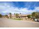 Single-story home with desert landscaping, mature trees, and a convenient two-car garage at 3236 Cliff Sieler Ct, Las Vegas, NV 89117