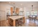 Bright and modern kitchen with a center island, bar seating, and an adjacent dining area at 3236 Cliff Sieler Ct, Las Vegas, NV 89117