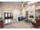 Bright living room features modern lighting, fireplace, light wood floors and comfortable seating at 3236 Cliff Sieler Ct, Las Vegas, NV 89117