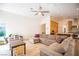 Inviting living space with a comfortable sectional sofa and a view of the modern kitchen at 3236 Cliff Sieler Ct, Las Vegas, NV 89117