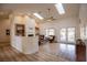 Bright and open living room with skylights, fireplace, modern furnishings, and access to patio at 3236 Cliff Sieler Ct, Las Vegas, NV 89117