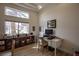 Bright home office with modern computer setup, large window, and abundant storage at 3236 Cliff Sieler Ct, Las Vegas, NV 89117