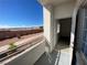 The open door leads to a balcony overlooking the scenery at 3318 N Decatur Blvd # 1056, Las Vegas, NV 89130