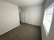 This bedroom has carpet, windows, and a closet at 3318 N Decatur Blvd # 1056, Las Vegas, NV 89130