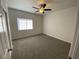 The bedroom provides a ceiling fan and window for natural lighting at 3318 N Decatur Blvd # 1056, Las Vegas, NV 89130