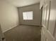 Neutral bedroom with a window, carpet, and closet with sliding doors at 3318 N Decatur Blvd # 1056, Las Vegas, NV 89130