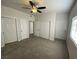 Spacious bedroom featuring multiple closets and a ceiling fan at 3318 N Decatur Blvd # 1056, Las Vegas, NV 89130