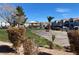 Community park featuring picnic tables and trees, surrounded by beautiful townhome buildings at 3318 N Decatur Blvd # 1056, Las Vegas, NV 89130