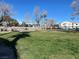 Expansive green space with trees and a walking path, perfect for outdoor activities at 3318 N Decatur Blvd # 1056, Las Vegas, NV 89130