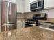Kitchen with stainless steel appliances and granite countertops at 3318 N Decatur Blvd # 1056, Las Vegas, NV 89130