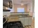 Kitchen sink and gas range with view of adjacent room at 3318 N Decatur Blvd # 1056, Las Vegas, NV 89130