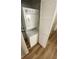 The laundry area includes a stacked washer and dryer with wooden floors at 3318 N Decatur Blvd # 1056, Las Vegas, NV 89130