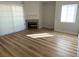 Bright, open living area with modern fireplace and wood-look flooring at 3318 N Decatur Blvd # 1056, Las Vegas, NV 89130