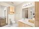 Bright bathroom featuring a single sink vanity, neutral color palette, and modern light fixture at 354 Sunward Dr # 0, Henderson, NV 89014