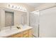 Bathroom features a double sink vanity, a shower with a glass door, and modern lighting at 354 Sunward Dr # 0, Henderson, NV 89014