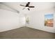 Carpeted bedroom with ceiling fan, closet, and natural light from two windows at 354 Sunward Dr # 0, Henderson, NV 89014