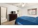 Comfortable bedroom with a dresser, TV, and adjacent bathroom and laundry area access at 354 Sunward Dr # 0, Henderson, NV 89014