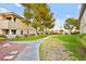 Well-manicured green space with mature trees and a walkway winding through the community at 354 Sunward Dr # 0, Henderson, NV 89014