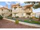 Multi-level condo building featuring tan stucco, terracotta roof tiles, and well-maintained landscaping at 354 Sunward Dr # 0, Henderson, NV 89014