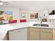 Bright kitchen featuring white countertops, stainless steel sink, and modern appliances near dining area at 354 Sunward Dr # 0, Henderson, NV 89014