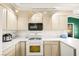 Bright kitchen with stainless steel appliances, white countertops, and ample cabinet space at 354 Sunward Dr # 0, Henderson, NV 89014
