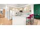 Bright kitchen boasts ample cabinet space, quartz countertops, breakfast bar, and stainless steel appliances at 354 Sunward Dr # 0, Henderson, NV 89014