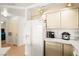 Well-lit kitchen area featuring white cabinets, a refrigerator, and counter space with small appliances at 354 Sunward Dr # 0, Henderson, NV 89014