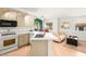 Modern kitchen with stainless steel appliances, a breakfast bar, and a bright, open layout at 354 Sunward Dr # 0, Henderson, NV 89014