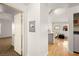Open-concept living area with hardwood floors, kitchen view, and neutral decor at 354 Sunward Dr # 0, Henderson, NV 89014