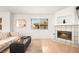 Inviting living room with a cozy fireplace, neutral decor, and lots of natural light at 354 Sunward Dr # 0, Henderson, NV 89014