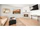 Cozy living room with a decorative fireplace, large window, and comfortable seating at 354 Sunward Dr # 0, Henderson, NV 89014