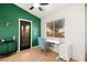 Bright office area with stylish green walls, a modern desk, and a door leading to the outside at 354 Sunward Dr # 0, Henderson, NV 89014